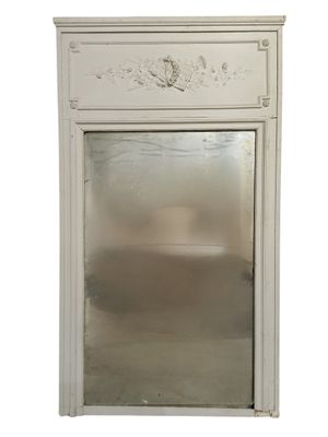 a mirror in the middle of a white cabinet