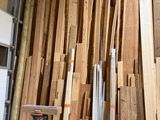many pieces of wood stacked up in a room