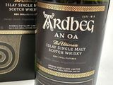 an image of a bottle of ardbeg an o with a box on the side