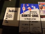 many different types of posters on display on a table