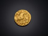 une pièce d'or avec l'image d'un homme sur un cheval