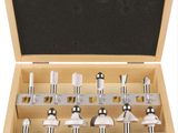 a wooden box with a set of drill heads in it