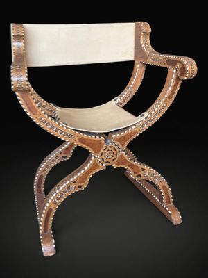 an image of a chair made out of wood and rope