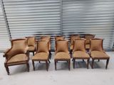 six chairs in a row in front of a garage door
