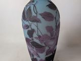 a vase that has a purple and blue design on it