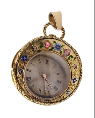 a gold clock with flowers on it on a white background