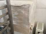 a stack of boxes and a radiator in a room