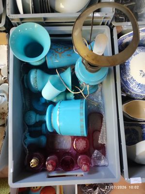 a box full of blue and white dishes and cups