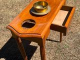 a wooden table with two bowls on top of it