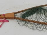 a tennis racket with a net attached to it