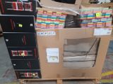 many boxes of assorted items on a pallet in a warehouse