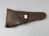 an old leather sheath with a tag on it
