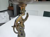 bronze plated vase with a woman holding a bird on it