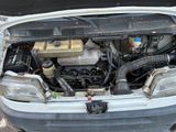 a car that has its hood open with the engine in it