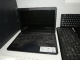 two laptops that are sitting on a counter