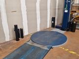 a picture of a room with a floor mat and a fork lift