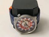 a watch that is sitting on top of a black box
