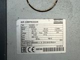 a label on the back of a machine that says air compressor