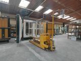 a large warehouse with a fork lift in the middle of it