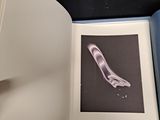 an open book with a picture of a foot on it