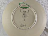 a white plate with a picture of a soccer player on it