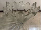 a glass bowl that is sitting on a table