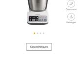 a close up of a blender on a table with a price tag