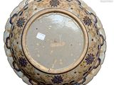 an image of a decorative plate with a blue border