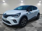 a white renault c - cross suv parked on a checkered floor