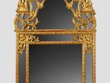 an image of a mirror with a gold frame on a white background