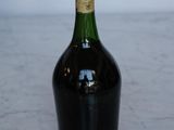a bottle of wine that is sitting on a table