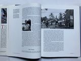 an open book with a picture of a man on a motorcycle