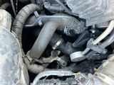 a close up of a car ' s engine and its hoses