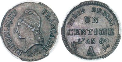 an old coin with a woman ' s head on it