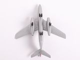 a toy airplane that is sitting on a white surface