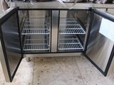 a stainless steel refrigerator with two doors open