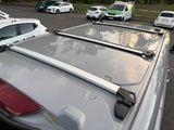 many cars parked in a parking lot next to each other