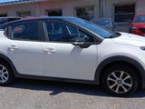 a white car that is parked in a parking lot