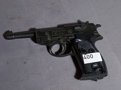a gun with a tag on it laying on the floor