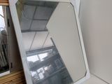 a mirror that is sitting on a table next to a mirror