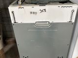 a white dishwasher sitting on top of a wooden stand