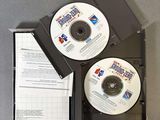 two cd ' s in the case on the table