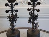 two candles that are sitting on a marble table