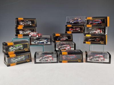 a lot of toy cars that are in a display case