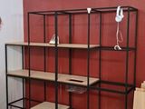 a man that is standing in front of a shelf