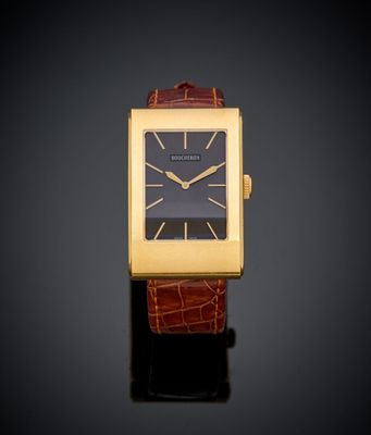 une image représentant une montre en or sur fond noir