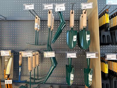 many different types of garden tools on display in a store