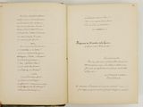an open book with a handwritten poem on it sitting on a table