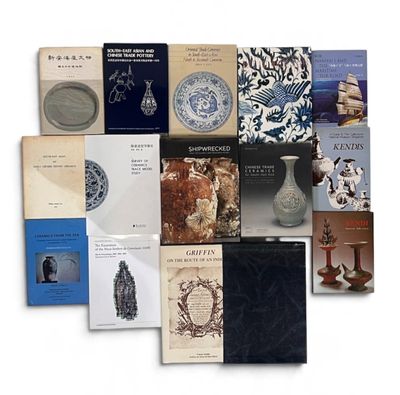 a lot of books that are sitting on a table