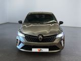 the front view of a silver car in a showroom
